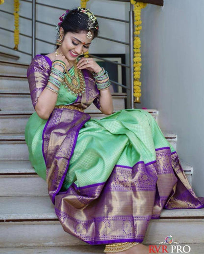 "Floral Symphony: The Majestic Green and Purple Saree"