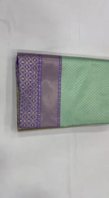 "Floral Symphony: The Majestic Green and Purple Saree"